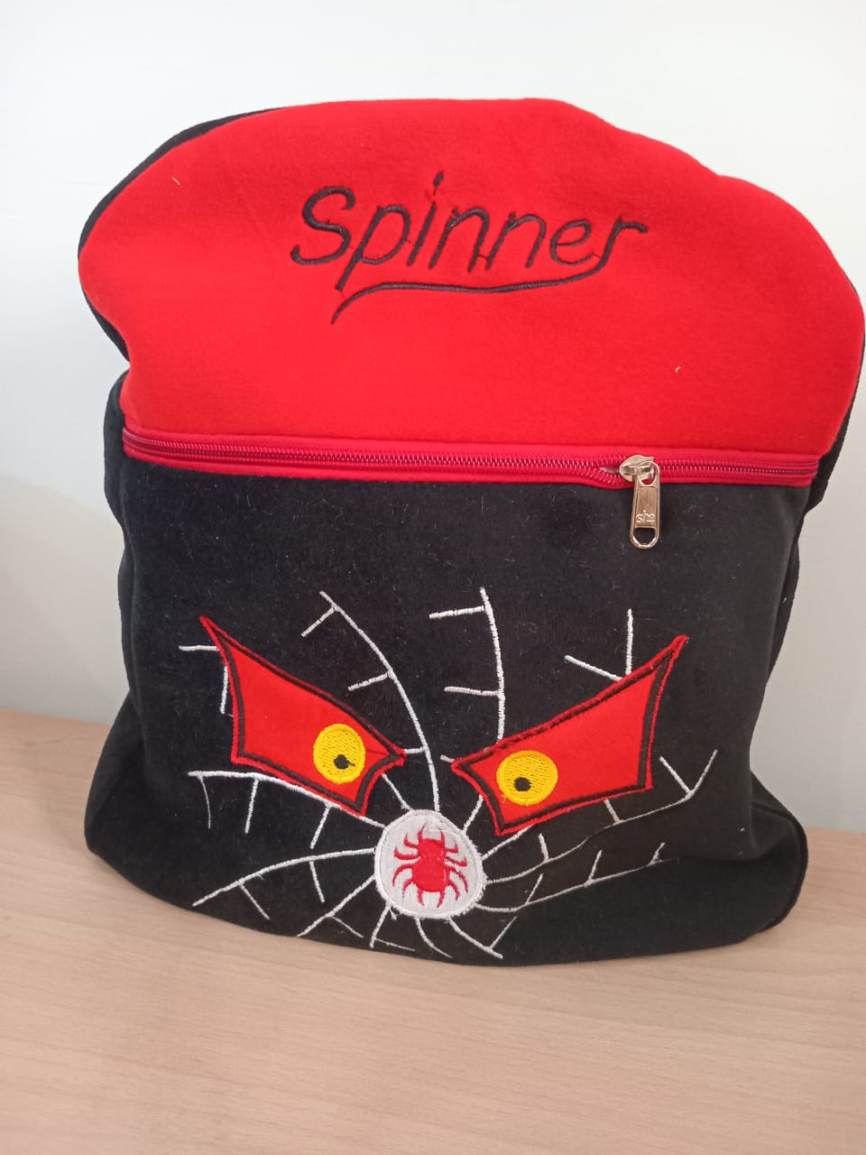 Black Spinner Plush Backpack