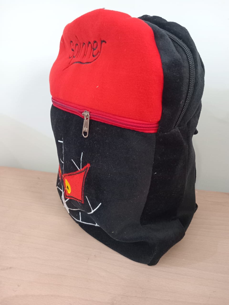 Black Spinner Plush Backpack