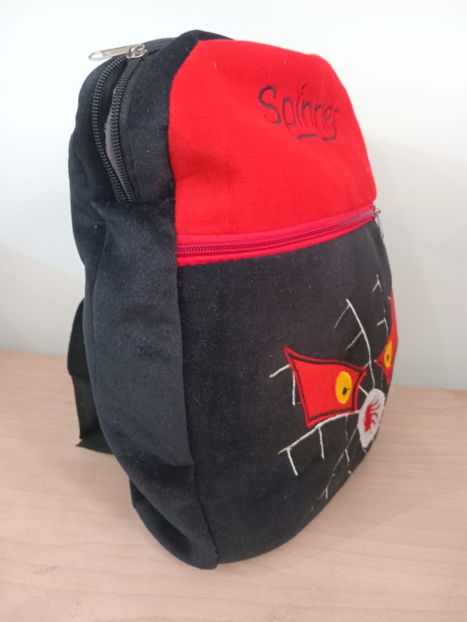 Black Spinner Plush Backpack